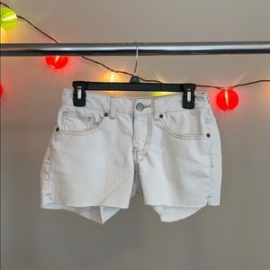 I am selling white jean shorts.